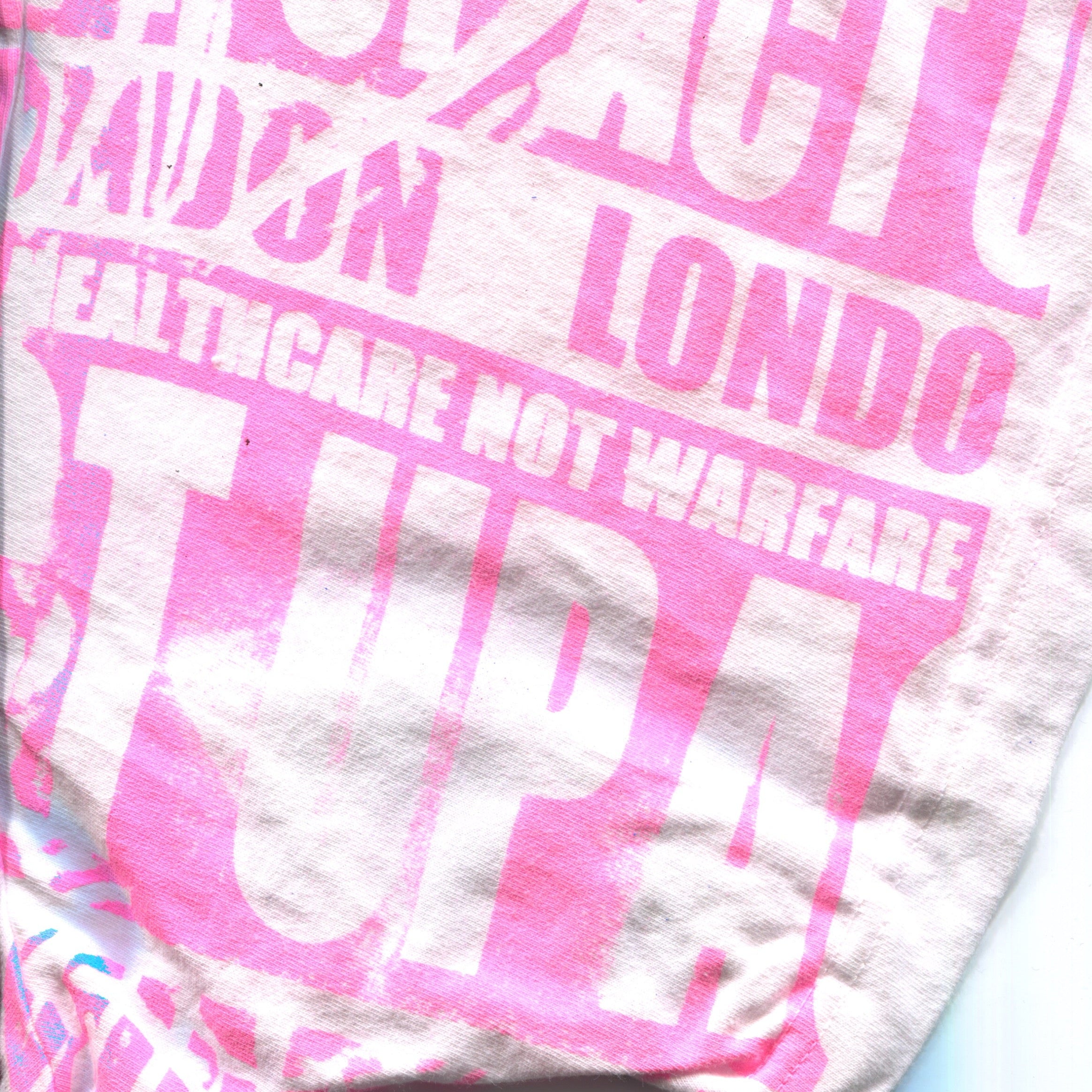 10F1 HEALTH CARE NOT WARFARE TEE